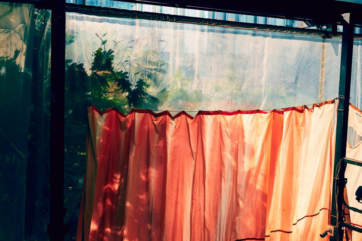 how to hang outdoor curtains on a covered patio with rust-resistant rod and weatherproof fabric